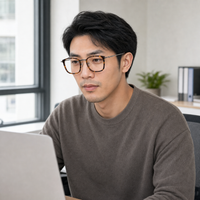 Armand eyewear, worn in a bright daytime office
