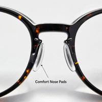 Adjustable clear nose pads on tortoiseshell optical frames