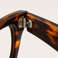 Sylvain eyewear, close-up of the frame, temple, and hinge construction