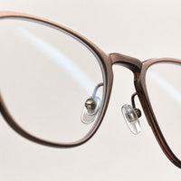 Dominique eyewear, close-up of the lenses and nose pad details